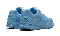 The Nike Zoom Vomero 5 "University Blue" is a monochromatic blue colorway of the retro running shoe.  Debuted in 2010, the Zoom Vomero 5 was re-introduced as a lifestyle shoe via a collaboration with Samuel Ross’s *A COLD WALL clothing brand in 2018, and again beginning in 2022.  Here, the “University Blue” finishes the shoe with an all-blue design.  The upper features a University Blue mesh construction with tonal overlays throughout.  A University Blue leather Swoosh appears on both sides of t Nike Vomero, Retro Running Shoes, University Blue, Blue Nike, Nike Zoom, Blue Design, Blue Shoes, Blue Leather, Nike Shoes