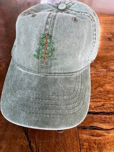 "Embroidered pine tree \"dad cap\". Available on washed green or gray adjustable cap." Cute Hats For Women Ball Caps, Embroidered Photo, Group Gifts, Hat Embroidery, Diy Hat, Ball Caps, Dad Cap, Tree Farm, Womens Baseball Cap