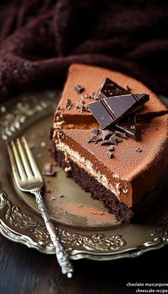 a piece of chocolate cake on a plate with a fork