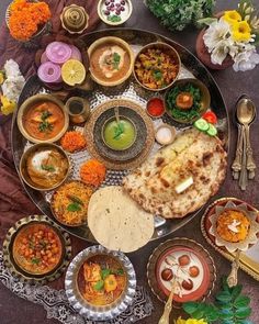 a platter filled with lots of different types of food on top of a table