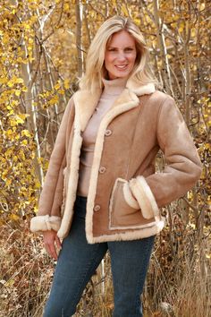 COLOR PICTURED:  (Gold Misty)  To view all the colors available visit my website:  www.thesheepherder.com  Selec:t Design Studio/Colors and Options/SheepskinRanch or town, the High Country Sheepskin Jacket is designed for special occasions. This hip-length shearling jacket features princess seams with wool trim down the front and around the bottom. The cut is trim and sophisticated as well as feminine. The coat is pictured with a shawl collar and 3" roll cuffs, but also looks great with a notche Sheepskin Jacket, Sheepskin Coat, Coat For Women, Womens Jackets, Shearling Coat, Coat Outfits, Winter Coats Women, Shearling Jacket, Winter Wear