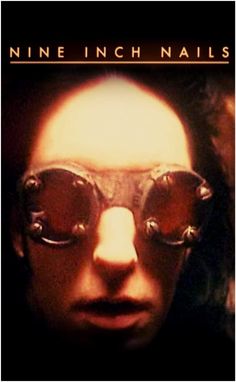 the poster for nine inch nails shows an image of a man with glasses on his face