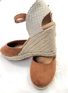 Dark Camel closed toe wedge with ankle strap! The toe is a round toe in faux suede. The heel is approximately 3.5 inch high Brown Suede Wedge Sandals, Brown Suede Wedge Heel Sandals, Beige Suede Wedge Sandals, Beige Suede Closed Toe Wedge Sandals, Brown Wedge Sandals With Wrapped Heel And Round Toe, Suede Platform Wedge Sandals With Round Toe, Beige Closed Toe Suede Wedge Sandals, Brown Suede Wedge Sandals With Ankle Strap, Medium Width Suede Wedge Sandals