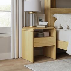 a bed room with a neatly made bed and a night stand next to the window