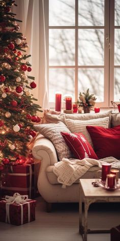 a living room with a christmas tree in the corner and presents on the table next to it