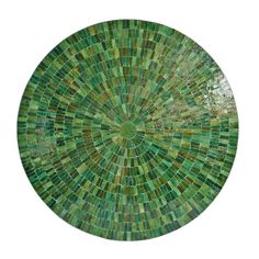 a circular green mosaic tile design on a white background