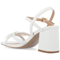 This vegan leather sandal with bows and buckles just might become your new fave.  • Open-Toe  • Sandals  • Buckle  • Padded Insole  • 2 1/2- in Block Heel  • Vegan Leather   
   All measurements are approximate and were taken using a size 6. Please note measurements may vary slightly by size. Block Heel Platform Sandals, Platform Block Heels, Sandals White, Open Toed Heels, Open Toe Shoes, Buckle Shoes, Round Toe Heels, Shoes Heels Pumps, Open Toe Sandals