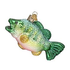 a green and yellow fish ornament hanging from a hook