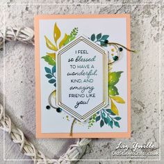 a handmade card with an inspirational quote on the front and bottom, surrounded by leaves