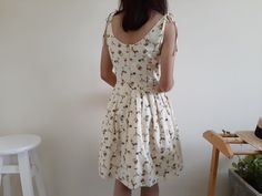 "Cream Tie Strap Cocktail Glass Print Dress - Canvas fabric - Invisible nylon zipper up back - Fixed waist - Fully lined - Pleated skirt - Ready to ship in 1-3 business days Measurements : Bust : 36\" Waist : 28\" Hips : free Length : 36.5\" Shoulder to waist : 15.5\" Model height : 5'6\" bust : 33\" waist : 25\" hips : 35\" Please read the policies tab before purchase. I can't have a model for clothes of all sizes, but I have already clearly written a model size. If you have questions about the Knee-length Cotton Sundress For Dress Down Occasions, Knee-length Cotton Sundress For Dress Down, Fitted A-line Cotton Sundress, Cotton Knee-length Sundress For Dress Down, Casual Knee-length Cotton Sundress, Cotton Knee-length Sundress For Casual Wear, Knee-length Cotton Mini Dress Lined, Beige Cotton Mini Dress For Daywear, Beige Cotton Sundress