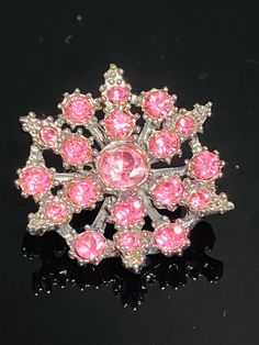 "This listing is for a beautiful vintage pink rhinestone brooch.  It is in excellent condition and would be lovely on a winter coat! Size:  1.25\" D Favor our Shop and Browse for More Great Vintage Items: https://www.etsy.com/shop/MarketplaceVintage1 Follow us on Instagram: @MarketplaceVintage1 Facebook: @MarketplaceVintage" Wedding Brooch, Rhinestone Brooches, Pink Rhinestones, Clear Rhinestones, Vintage Pink, Winter Coat, Antique Jewelry, Follow Us, Vintage Antiques