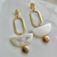 Big Bold Statement Earrings, Minimalist style earrings, Matte Gold Earrings Ultra modern earrings, clean cut design to complement any outfit. Very Light weight. Materials: Gold plated brass, Rubberized acrylic bead. Size: Style A 2.6" long, Style B 3" long Your purchase comes in a beautiful box that is ready to give as a gift or to keep for yourself. **Please be sure to read my shop policies and shop announcement before making your purchase Matte Gold Earrings, Contemporary Earrings, Earrings Geometric, Earrings Minimalist, Earrings Black, Earrings Statement, White Earrings, Modern Earrings, Geometric Earrings