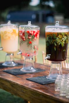 three different types of drinks on a table