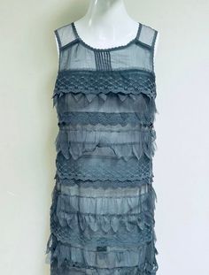 Beautiful NWT / New With Tag / Never Worn Deadstock pewter grey floral lace and netting semi-sheer mini-dress / tunic. Sleeveless party dress with a tiered column design similar to flapper Era dresses.  Perfect Summer dress and in Winter looks amazing paired with tights, boots, and a cardigan.  Looks like something Daisy would wear in The Great Gatsby!  💥Condition: Pristine vintage condition. New With Tag / NWT / Never Worn Deadstock  💥Tag Size: Medium Please see measurements before buying. Me Victorian Cottagecore, Era Dresses, Tights Boots, Flapper Era, Sheer Mini Dress, The Great, Column Design, Lace Party Dresses, Pewter Grey