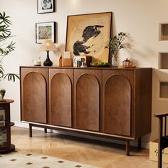 a wooden cabinet sitting in the middle of a living room