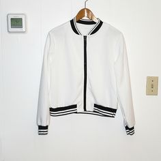 Nwot White & Black Textured Baseball Jacket Size L. Smoke Free Home. Zippered Closure 21' Length 22' Pit To Pit 23' Sleeves Ub Trendy White Outerwear With Ribbed Cuffs, White Spring Track Jacket With Zipper, White Track Jacket With Zipper For Spring, White Track Jacket With Zipper Closure For Fall, White Track Jacket For Spring, White Zipper Track Jacket For Winter, White Zipper Closure Outerwear For Work, White Sporty Outerwear For Work, Sporty White Outerwear For Work