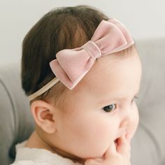 Handmade in the USA Sweet and chic, made with a super soft velvet ribbon, our tiered double loop velvet bow headband is the perfect finishing touch to her special outfit! A hand-stretched nylon band allows for a comfortable fit that will grow with your little one. Double face velvet ribbon Hand-stretched nylon Baby pictured in Large bow Adjustable Pink Bow Headband, Adjustable Pink Headband With Bow, Cute Adjustable Bow With Matching Headband, Cute Adjustable Hair Accessories With Satin Bow, Cute Adjustable Pink Bow Hair Accessories, Cute Adjustable Headband With Bow Tie, Cute Adjustable Hair Accessories With Pink Bow, Adjustable Pink Bow Tie, Pink Satin Bow Headband Gift