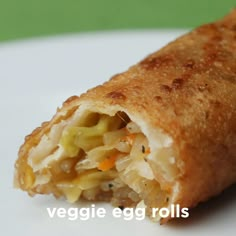 a vegetable egg roll on a white plate