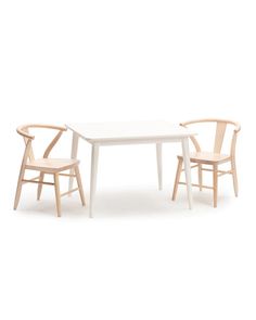 two chairs and a table are shown against a white background, with one chair facing the other