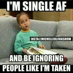 a kid sitting on top of a couch next to a book that says i'm single af and be ignoring people like it