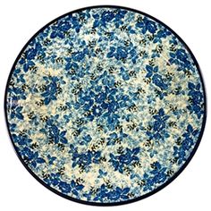 a blue and white plate with flowers on it