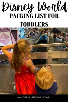 two young children looking at an escalator with the words disney world packing list for toddlers