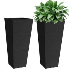 two tall black planters sitting next to each other on top of a white background