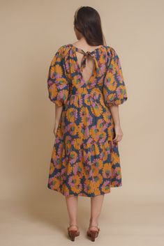 Brand: Moodie Puff sleeve midi dress with vibrant floral print. Dress has side pockets and an open back with tie. ♡ Details Color: Multi Puff sleeves Hidden side pockets Open tie back Partially lined 100% Cotton | Lining; 70% Polyester, 30% Cotton Hand wash recommended Size & Fit Model info: Height 5'3"| Bust 32"| Waist 25"| Hips 34" Model is wearing a size XS Fit: Relaxed fit Stretch: No stretch Measurements: XS: Bust = 35" | Waist = 34" | Length = 42.5" S: Bust = 36" | Waist = 35" | Length = 4 Puff Sleeve Midi Dress, Sleeve Midi Dress, 5 S, Midi Length Dress, Tie Backs, Tie Back, Floral Print Dress, Puff Sleeves, Midi Length