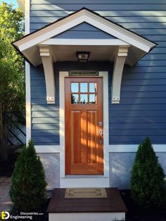 a blue house with a wooden front door