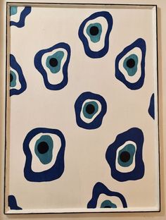 an abstract painting in blue and white with black dots on the bottom half of it