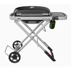 an image of a bbq grill with wheels on the side and a bottle sitting on top