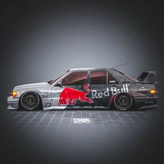 the car is painted with red bull on it