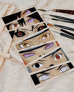 the eyes are drawn on paper with pencils next to them