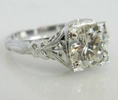 Here is a beautiful vintage Art Deco Engagement Ring with an outstanding, LARGE Diamond. A wonderful engagement ring complete with the timeless beauty and design from the Art Deco period. The delicate cut outs and floral pattern create a stunning design. The sheer size and shine of this 1.78 carat diamond create a truly eye catching piece. This is the perfect engagement ring for anyone looking for the beauty and style from the Art Deco period with a stunning diamond that is sure to be noticed an Platinum Wedding Rings With Single Cut Diamonds, Classic White Diamond Engraved Ring, Antique Cushion Cut Rings For Formal Occasions, Elegant Formal Wedding Ring With Diamond Cut, Vintage Cushion Cut Diamond Rings, Art Deco Cushion Cut Diamond Ring For Formal Occasions, Art Deco Cushion Cut Diamond Ring For Formal Events, Vintage White Platinum Diamond Ring, Vintage White Diamond Ring In Platinum