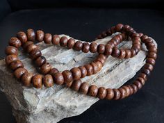 Natural 108 beads Bodhi Seed mala prayer beads from Nepal. Here's why it's a must-have for your spiritual practice: Sacred Bodhi Seeds: Known as the seeds of enlightenment, each of the 108 beads (10 mm size) is a symbol of knowledge and spiritual growth. Handcrafted Quality: Lovingly hand-strung, this mala boasts authenticity and the unique touch of Nepalese craftsmanship. Versatile Use: Ideal for counting mantras, prayers, and other spiritual practices. Enhance your meditation with the resonant Traditional Round Wooden Beaded Bracelets, 8mm Round Beads For Festivals, Festival Wooden Beaded Bracelets, Traditional Round Wooden Beads, Rope Incense, Beads Mala, Bracelets Handmade Diy, Om Mani Padme Hum, Spiritual Tools