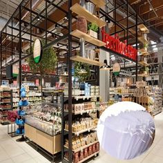 the inside of a grocery store with shelves filled with food and items on display in front of them