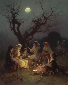 a group of women sitting around a campfire under a full moon