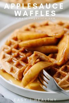 two plates with waffles on them, one is topped with syrup and the other has a fork