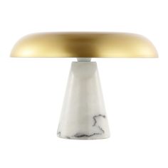 a white and gold colored table lamp on a white background with a light bulb in the shape of a mushroom