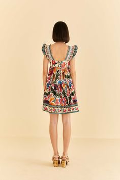 We just can't get enough of the Off-White Tropical Yard Sleeveless Mini Dress. This refreshing one-piece features ruffled shoulders and a flowy skirt, giving you an easy-breezy silhouette. Its flowerful print brings Brazil's nature elements to give your moments a tropical twist. Enhance the look with artisanal accessories, and get ready to bloom all season long. Sleeveless; Ruffle detailing on shoulders; Square neckline; Invisible zipper at side seam. Composition 100% COTTON Care Instructions HAND WASH SEPARATELY, DO NOT BLEACH, DO NOT TUMBLE DRY, LINE DRYING, IRON AT LOW HEAT, DO NOT DRY CLEAN Size and Fit Inches XXS XS S M L XL Bust 31 3/4 33 1/4 34 1/4 35 1/4 36 3/4 38 1/4 Waist 26 1/2 28 29 30 31 1/2 33 Length 32 3/4 33 1/4 33 3/4 34 1/4 34 3/4 35 1/4 Hip 49 1/2 51 52 53 54 1/2 56 Tropical Yard, Nature Elements, Fresh Dress, Tropical Twist, Short Styles, Levis Denim, Easy Breezy, Farm Rio, Swimwear Sale