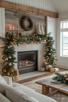 a living room filled with furniture and a fire place covered in christmas wreaths next to a fireplace