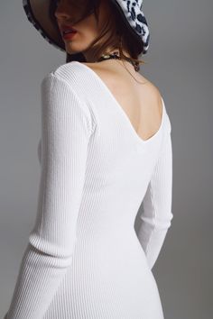 Introducing our Midi Bodycon Knitted Dress with V-neck in White, the epitome of versatile elegance. Crafted from a premium blend of 40% viscose, 30% polyester, and 30% nylon, this dress promises a form-fitting silhouette that compliments your every curve. The ribbed knit texture not only provides a tactile treat but also ensures that the dress molds perfectly to the body. Its distinctive low scoop neck offers a hint of allure while remaining effortlessly chic, granting you the flexibility to sty Knitted Bodycon Dress, Ribbed Knit Dress, Knitted Dress, Bodycon Midi, Dress Designs, Knitting Designs, My Website, Mother Of The Bride, Knit Dress