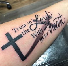 a cross with the words trust in the lord with all your heart