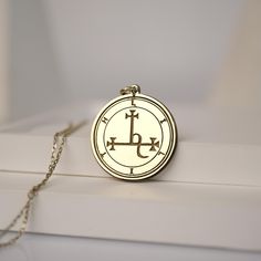 Discover the enchanting allure of the Handmade Engraved Sigil of Lilith Pendant Necklace, a captivating piece that combines mystical symbolism with elegant design. This exquisite gold-plated amulet is meticulously crafted to embody the powerful essence of Lilith, a figure of independence and strength. Material: 14K Solid Gold - 10K Solid Gold - 925K Silver - 925K Gold Filled  Design: Intricately engraved with the Sigil of Lilith Packaging: Comes in a beautiful gift box, ready for gifting Embrace the mystery and elegance of this unique pendant necklace, perfect for those who seek a connection to ancient symbols and a touch of magical charm. Whether you wear it as a personal talisman or a statement accessory, the Sigil of Lilith Pendant Necklace is sure to attract attention and admiration. C Symbolic Silver Jewelry With Laser Engraving, Silver Brass Jewelry With Engraving Option, Symbolic Silver Laser Engraved Jewelry, Symbolic Laser Engraved Silver Jewelry, Spiritual Medallion Jewelry With Engraving Option, Spiritual Round Pendant Jewelry With Engraving Option, Gold Spiritual Jewelry Laser Engraved, Spiritual Gold Jewelry Laser Engraved, Spiritual Gold Laser Engraved Jewelry