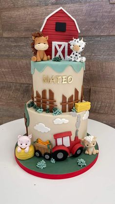 a birthday cake with farm animals on top