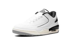 The Jordan 2/3 “White/Black” is a mostly two-toned, white-and-black colorway of the hybrid sneaker that blends elements of the Air Jordan 2 and Air Jordan 3.  The Jordan 2/3 combines details from the Jordan 2 and Jordan 3, including the sole unit from the Jordan 3 and the upper construction of the Jordan 2 Low, among other features.  On this colorway, the shoe is complete with a white leather construction with contrasting black accents on the heel counter, “Wings” logo on the tongue, and mudguar Jordan 2 Low, White Black Shoes, Jordan Golf, Air Jordan 2, Nike X Travis Scott, Black Jordans, Jordans Women, Wings Logo, Jordan 2