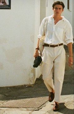 Stay Cool in Style: White Trousers Outfit Inspiration for Men! Beat the summer heat with these crisp white trousers paired with a light, breathable shirt. Whether you're strolling along the beach or enjoying a rooftop dinner, this outfit exudes effortless sophistication. Click the image to shop on Amazon and elevate your summer wardrobe! Grunge Outfits 90s, Japan Outfits, Old Money Fashion, Greek Summer, Money Fashion, 90s Fashion Men, Mens Summer Outfits, Homecoming Outfits