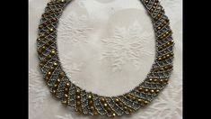 a beaded necklace with gold and silver beads