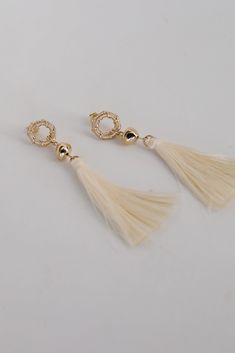 The Gracelyn Gold Tassel Earrings are the hit of the party! These trendy earrings start with a stud post back and have a tassel detail. Add these fun earrings to a black dress + heels to add a chic touch to your date night look! Gold Plated Tassels Stud Post Back One Size | Length 3” Elegant Beaded Tassel Earrings, Elegant Tassel Earrings For Party, Tassel Earrings For Wedding, Elegant Tassel Drop Earrings For Summer, Elegant Summer Tassel Drop Earrings, White Tassel Earrings For Pierced Ears Party, White Tassel Earrings For Party, Chic Evening Earrings With Tassels, Elegant Party Earrings For Spring