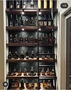 the shelves are filled with liquor bottles